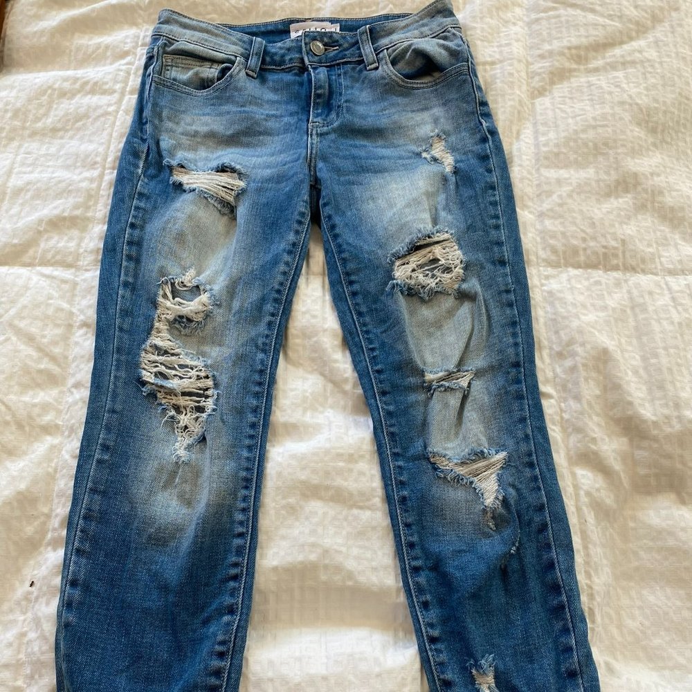 tattered blue jeans